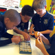 Students at the Atlanta Gifted Academy participate in a small group experiment with metamorphic, igneous and volcanic rocks.
Courtesy of the Atlanta Gifted Academy